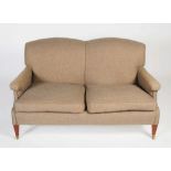 A two seat mahogany sofa in the style of Howard & Sons, the back, arms and loose cushion seat