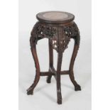 Chinese dark wood urn stand, Qing Dynasty, the circular top with pink and white marble insert