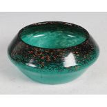 A Monart Bowl, shape X, mottled black and green with gold coloured inclusions, overall 18cm diameter