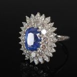 A white metal sapphire and diamond cluster ring, 20th century, centred with a rectangular cushion