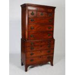 A late 18th century American mahogany chest on chest, the moulded cornice and plain frieze over