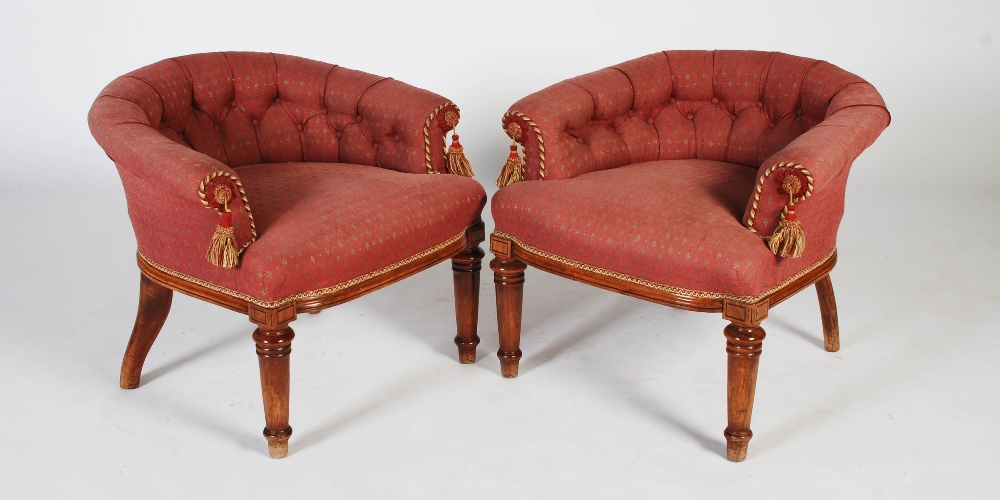 A pair of late 19th century horseshoe back conversation chairs, the button down upholstered backs