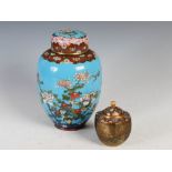 Two Japanese cloisonne jars and covers, Meiji Period, comprising a blue ground jar and two covers