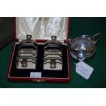 BIRMINGHAM SILVER CREAM JUG TOGETHER WITH A CASED PAIR OF BIRMINGHAM SILVER FIVE BAR TOAST RACKS.