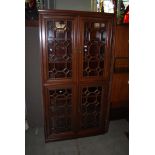 A CHINESE DARKWOOD DISPLAY CABINET / BOOKCASE WITH TWO PAIRS OF SIMULATED ASTRAGAL GLAZED DOORS