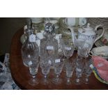 COLLECTION OF GLASSWARE TO INCLUDE TWO DECANTERS AND STOPPERS, ASSORTED DRINKING GLASSES.