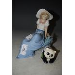 NAO PORCELAIN FIGURE OF GIRL WEARING WIDE-BRIMMED HAD, TOGETHER WITH A BESWICK BLACK AND WHITE PANDA