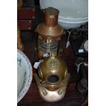 A COPPER AND BRASS PARAFFIN BURNING SHIPS LANTERN, TOGETHER WITH A COPPER AND BRASS MODEL OF A