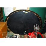 A 19TH CENTURY BLACK AND GILT TOLE WARE OVAL DRINKS TRAY