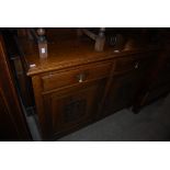 LATE VICTORIAN OAK DRESSER WITH TWO FRIEZE DRAWERS, TWO FOLIATE CARVED CUPBOARD DOORS