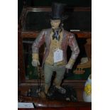 A LATE 19TH CENTURY COLD PAINTED WHITE METAL DOORSTOP IN THE FORM OF A GENTLEMAN WEARING TOP HAT AND