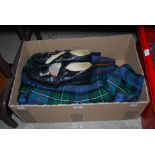 BOX CONTAINING MATCHING KILT AND CUMBERBAND, ANOTHER KILT AND A PAIR OF GENTS HIGHLAND BROGUES.