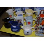 COLLECTION OF EIGHT ASSORTED PUB ALCOHOL ADVERTISING JUGS, TENNENTS, TEACHERS, BELLS, ETC.