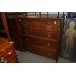 AN EARLY 20TH CENTURY STAINED PINE FOUR DRAWER CHEST ON SQUARE TAPERED SUPPORTS AND CASTERS