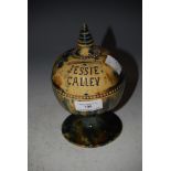 A SCOTTISH POTTERY MONEY BANK, INSCRIBED 'JESSIE CALLEY' WITH MOTTLED BLUE, GREEN AND BROWN GLAZE