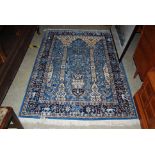 BLUE GROUND PERSIAN RUG, DECORATED WITH TREE OF LIFE DESIGN IN BORDER OF ANIMALS, FLOWERS AND