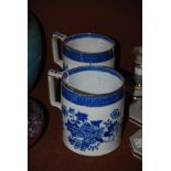 A NEAR PAIR OF 19TH CENTURY PEARLWARE TANKARDS IN THE CHINESE EXPORT TASTE WITH TRANSFER PRINTED