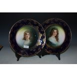 A PAIR OF LATE 19TH / EARLY 20TH CENTURY CONTINTENTAL COBALT BLUE GROUND PORCELAIN CABINET PLATES