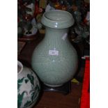 A CHINESE PORCELAIN CELADON VASE, CARVED WITH DRAGON AND SCROLLS WITHIN RUYI BORDER, SIX CHARACTER