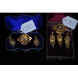 SUITE OF VICTORIAN YELLOW METAL, BLUE ENAMEL AND SPLIT PEARL JEWELLERY COMPRISING QUATREFOIL OVAL