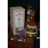 A BOXED FAMOUS GROUSE HIGHLAND DECANTER TO COMMEMORATE 100 YEARS, TOGETHER WITH A WADE BELLS OLD