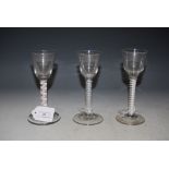 THREE ASSORTED 18TH CENTURY OPAQUE TWIST WINE/ CORDIAL GLASSES.