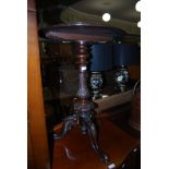 A VICTORIAN BURR WALNUT OCCASIONAL TABLE WITH CIRCULAR TOP, FOLIATE CARVED COLUMN AND THREE