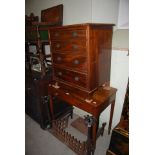 A GEORGE III REPRODUCTION MAHOGANY BACHELORS CHEST TOGETHER WITH A 19TH CENTURY MAHOGANY SIDE