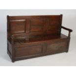 LATE 18TH / 19TH CENTURY OAK SETTLE, TRIPLE PANEL BACK AND HINGED SEAT