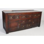A LATE 18TH / 19TH CENTURY OAK DRESSER WITH CENTRAL BANK OF THREE DRAWERS FLANKED BY TWO SMALL