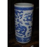 A CHINESE BLUE AND WHITE PORCELAIN UMBRELLA / STICK STAND WITH DRAGON AND CLOUD SCROLL DETAIL