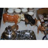 COLLECTION OF FOUR ASSORTED POTTERY ANIMALS TO INCLUDE BISON, BULL, CALF, DEER AND FAWN.