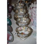 A COALPORT HAND PAINTED SET OF TEA CUPS AND SAUCERS WITH PALE GREY GROUND, FLORAL DECORATION AND