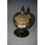 A SCOTTISH POTTERY MONEY BANK, INSCRIBED 'JESSIE CALLEY' WITH MOTTLED BLUE, GREEN AND BROWN GLAZE