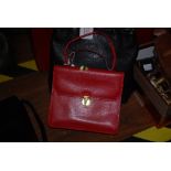 A DIDIER LAMARTHE SMALL CLUTCH PURSE WITH CARRY HANDLE IN RED LIZARD EFFECT LEATHER