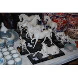 COLLECTION OF NINE BESWICK BISQUE PORCELAIN HORSE FIGURES MOUNTED ON EBONISED PLINTHS, ALL NAMED '