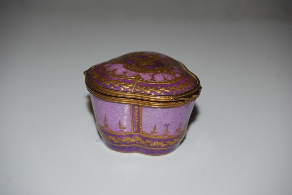 A SEVRES GILT METAL MOUNTED PURPLE GROUND PORCELAIN TREFOIL SHAPED BOX AND COVER