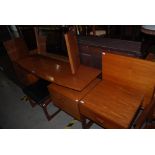 A MID 20TH CENTURY TEAK G-PLAN DRESSING TABLE WITH CENTRAL MIRROR AND TWO FOLD OUT SIDE MIRRORS ON