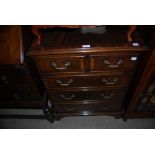A MODERN REPRODUCTION MAHOGANY SMALL CHEST OF TWO SHORT OVER THREE LONG DRAWERS