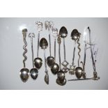 A COLLECTION OF ELEVEN INDIAN WHITE METAL COFFEE SPOONS WITH ANIMAL AND FIGURAL TERMINALS TOGETHER A