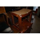 AN OAK CHEVAL MIRROR TOGETHER WITH AN OAK RECTANGULAR DRESSING TABLE STOOL WITH CONCAVE CANE WORK