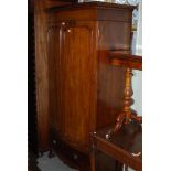 AN EARLY 20TH CENTURY MAHOGANY BOWFRONT WARDROBE WITH DENTAL FRIEZE