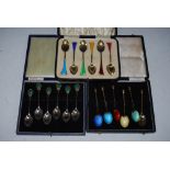 CASED SET OF SIX BIRMINGHAM SILVER AND ENAMEL COFFEE SPOONS WITH THISTLE SHAPED TERMINALS, A CASED