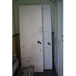 TWO LATE 19TH / EARLY 20TH CENTURY PAINTED PINE DOORS, BOTH WITH ORIGINAL FURNISHINGS, INCLUDING