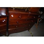 A 19TH CENTURY MAHOGANY CHEST OF TWO SHORT OVER THREE LONG GRADUATED COCKBEADED ON SPLAYED BRACKET