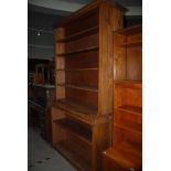 A REPRODUCTION OAK REGENCY STYLE OPEN BOOKCASE