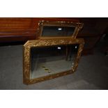 TWO MODERN GILT FRAMED WALL MIRRORS, ONE OF CHAMFERED SQUARE FORM WITH REPEATING LEAF AND BERRY