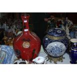 A LARGE BLUE AND WHITE LIDDED JAR WITH FLORAL DESIGN AND GILT DETAILING WITH BRASS MOUNTS TOGETHER