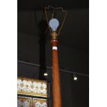 A 20TH CENTURY TURNED MAHOGANY STANDARD LAMP WITH PETAL DETAILING