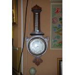 AN EARLY 20TH CENTURY ROSEWOOD AND MARQUETRY INLAID OIL BAROMETER